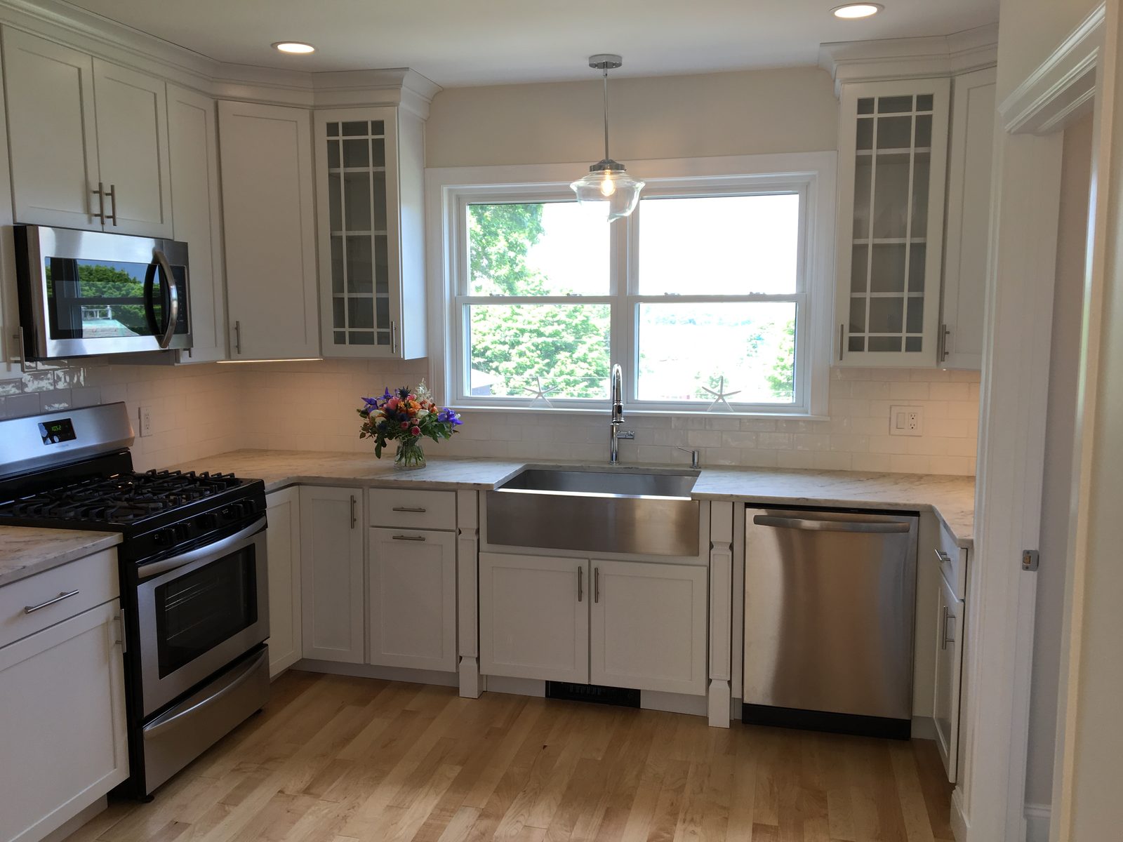 Open-concept kitchen renovation with custom cabinetry by BearHand